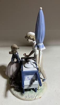 Lladro 5325 Ice Cream Vendor Boy And Girl with a Parasol Retired Figurine Mint
